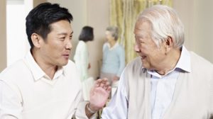 Elderly father and adult son