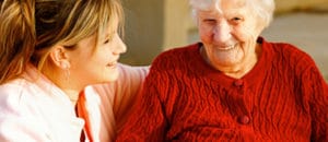 An elderly lady with her live-in carer